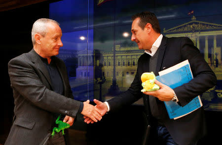 Greens lawmaker Peter Pilz and FPOe leader Heinz-Christian Strache shake hands after a news conference in Vienna, Austria March 3, 2017. REUTERS/Heinz-Peter Bader