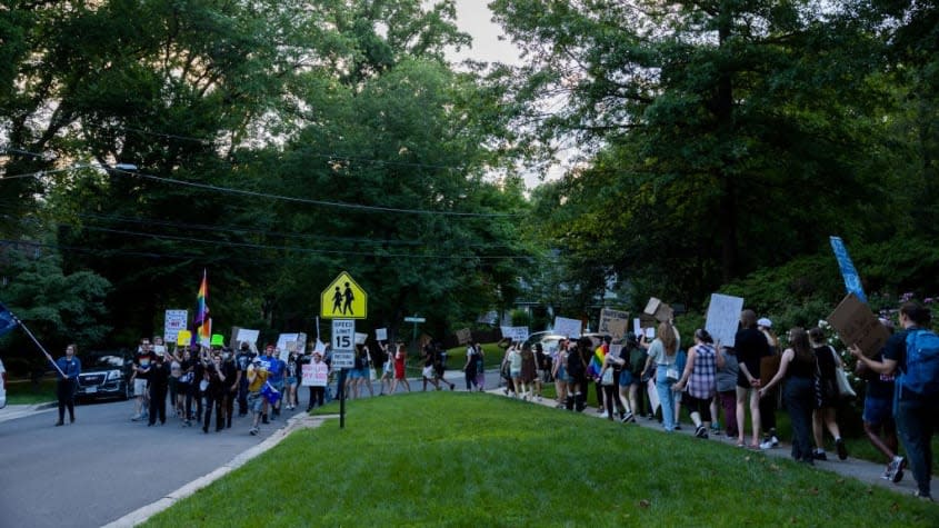 Abortion rights protesters march in front of Supreme Court Chief Justice John Roberts' house in Maryland.