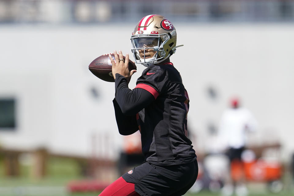 FILE - San Francisco 49ers quarterback Trey Lance (5) takes part in drills at the NFL football team's practice facility in Santa Clara, Calif., on June 7, 2022. Head coach Kyle Shanahan started camp Tuesday, July 26, 2022, by removing any pretense of a quarterback competition in San Francisco by unequivocally stating what had seemed obvious all offseason that Trey Lance will take over as starter a year after being drafted third overall. (AP Photo/Jeff Chiu, File)