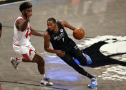 Brooklyn Nets forward Kevin Durant (7) drives to the basket around Chicago Bulls forward Patrick Williams during the second half of an NBA basketball game Saturday, May 15, 2021, in New York. (AP Photo/Adam Hunger)