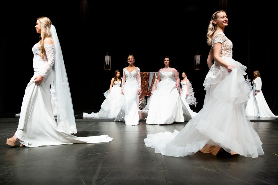 Models wear different wedding dresses from My Best Friend Jenna during a fashion show portion of the Jackson Bridal Show at the Carl Perkins Convention Center on Sunday, January 8, 2023, in Jackson, Tenn. 