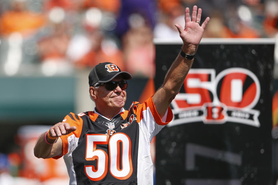Former Cincinnati Bengals quarterback Ken Anderson waves to the crowd during a halftime 50th anniversary ceremony last season. (AP) 