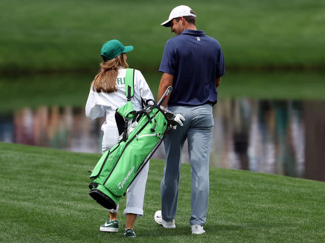 <p> Patrick Smith/Getty</p> Scottie Scheffler with his wife, Meredith Scheffler, during the Par 3 contest prior to the 2023 Masters.