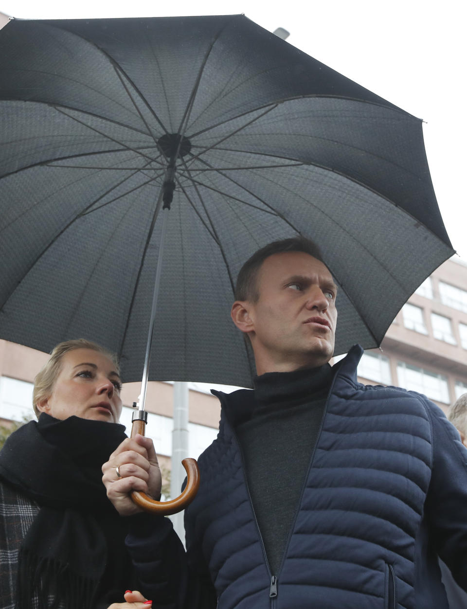 Russian opposition leader Alexei Navalny and his wife Yulia, attend a rally to support political prisoners in Moscow, Russia, Sunday, Sept. 29, 2019. (AP Photo/Dmitri Lovetsky)