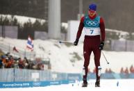 Cross-Country Skiing - Pyeongchang 2018 Winter Olympics - Men's 50km Mass Start Classic - Alpensia Cross-Country Skiing Centre - Pyeongchang, South Korea - February 24, 2018 - Silver medallist Alexander Bolshunov, Olympic athlete from Russia, reacts as he crosses finish line. REUTERS/Kai Pfaffenbach