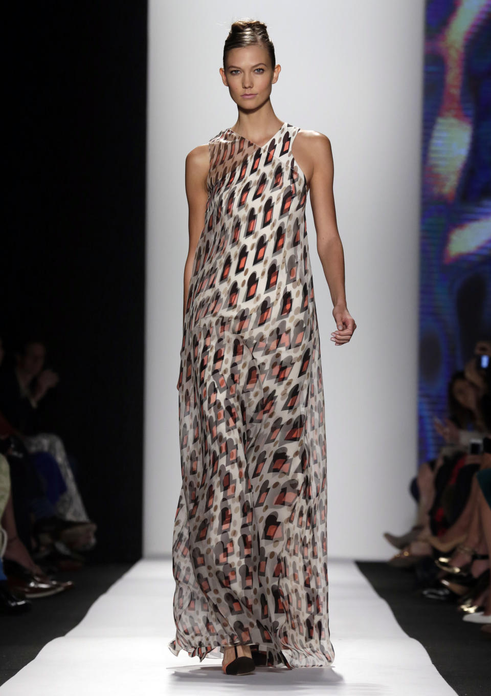 Karlie Kloss models an outfit from The Carolina Herrera Spring 2014 collection during Fashion Week in New York, Monday, Sept. 9, 2013. (AP Photo/Richard Drew)