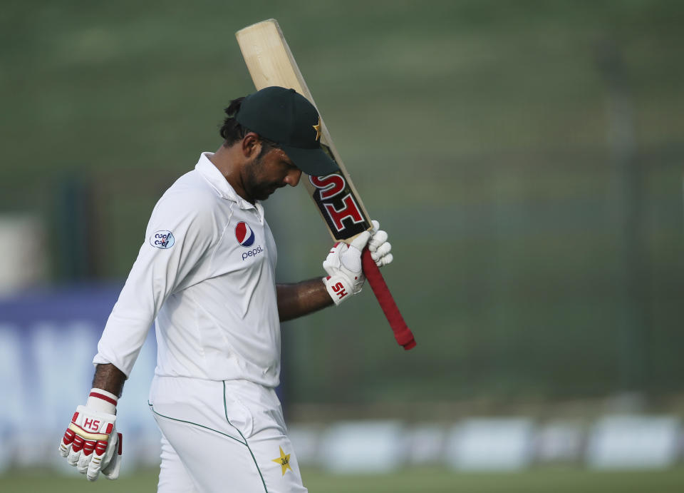 FILE - In this Thursday, Oct 18, 2018 file photo, Pakistan's Sarfaraz Ahmed leaves the field after his dismissal against Australia during their test match in Abu Dhabi, United Arab Emirates. Captain Sarfaraz Ahmed likes that Pakistan is considered an underdog entering the World Cup beginning next month, May, 2019 in England but insisted that despite the label, the 15-member squad is well prepared. Pakistan was ranked last in the Champions Trophy two years ago but won the eight-team event under Ahmed's captaincy. (AP Photo/Kamran Jebreili, File)