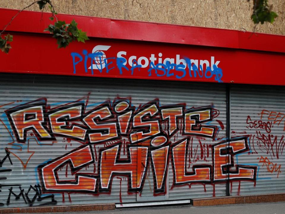  A Scotiabank gate is seen graffitied during a protest against Chile’s government in Santiago, Chile, Nov. 1, 2019.