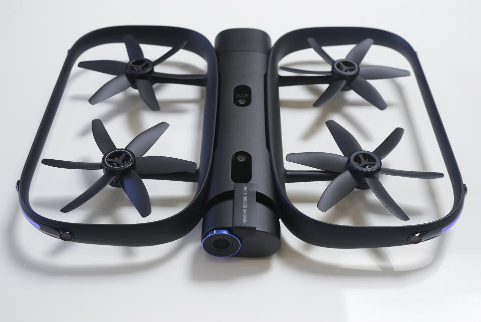 This June 22, 2018, photo shows a Skydio R1 drone in Redwood City, Calif. Skateboarders, surfers and YouTube stars used to be the target customers for California drone startup Skydio, which builds sophisticated self-flying machines that can follow people around and capture their best moves on video. Now it's police officers and soldiers getting equipped with the pricey drones. U.S. political and security concerns about the world's dominant consumer drone-maker, China-based DJI, have opened the door for Skydio and other companies to pitch their drones for government and business customers. (AP Photo/Jeff Chiu)