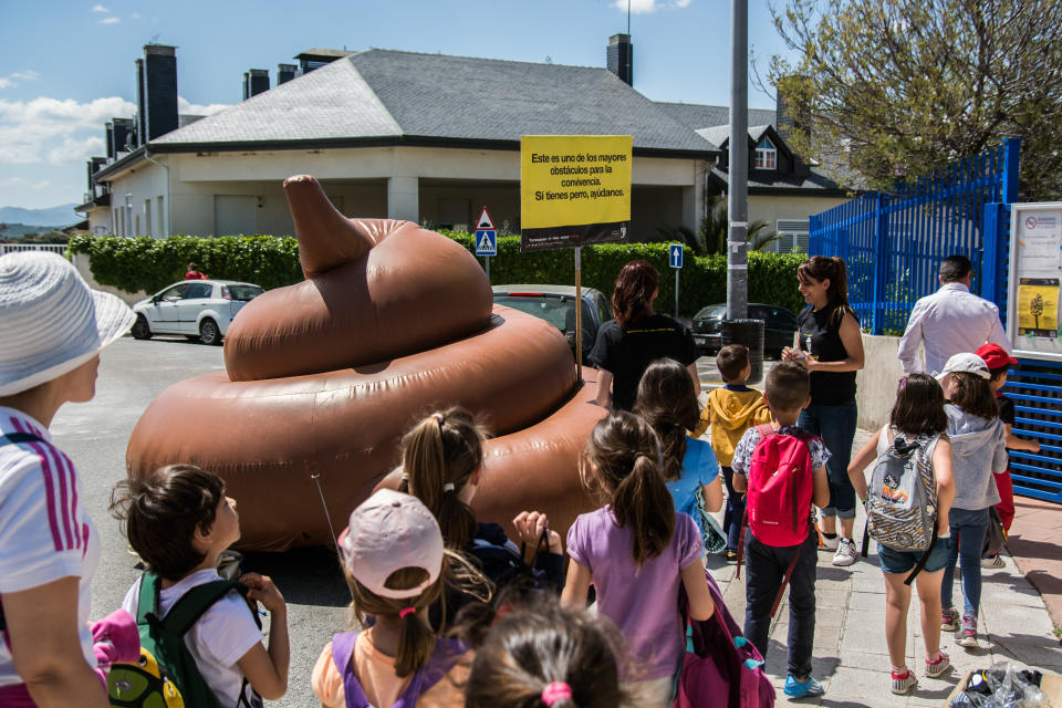 TORRELODONES, MADRID, SPAIN - 2016/05/27: An inflatable excrement of three meters is exhibited in schools of Torrelodones town near Madrid for a campaign to raise awareness of dog owners to pick up the excrement. (Photo by Marcos del Mazo/Pacific Press/LightRocket via Getty Images)