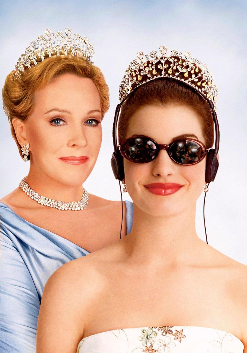 Two characters from 'The Princess Diaries': Queen Clarisse Renaldi and Mia Thermopolis wearing tiaras and formal attire, Mia with headphones