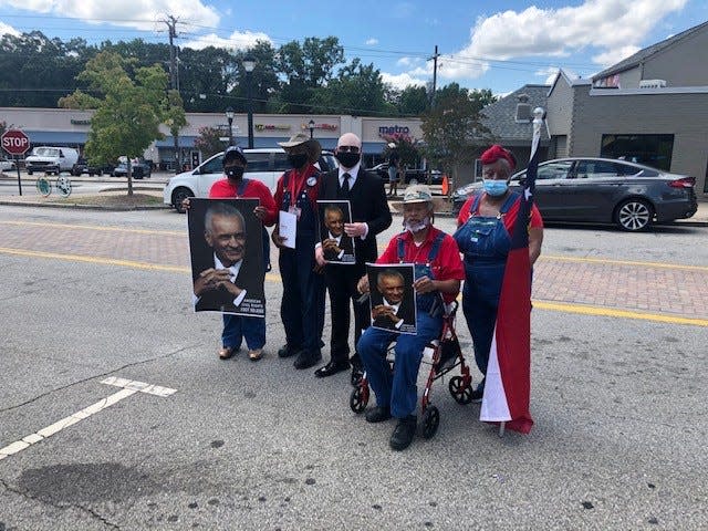 Mourners celebrate the life of civil rights activist C.T. Vivian outside Vivian's funeral at the Providence Missionary Baptist Church in Atlanta July 23.