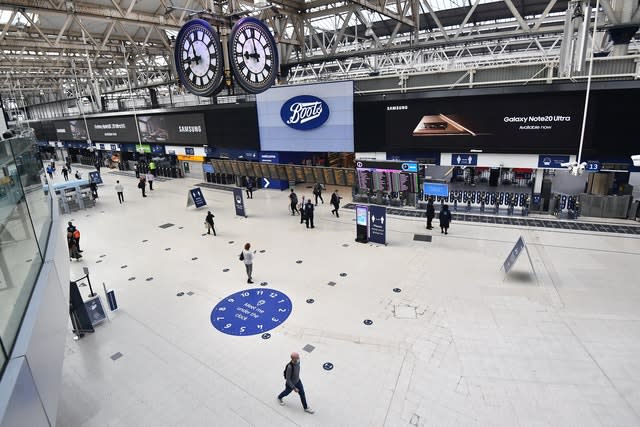 Commuters cross the concourse at Waterloo Station on Friday morning 