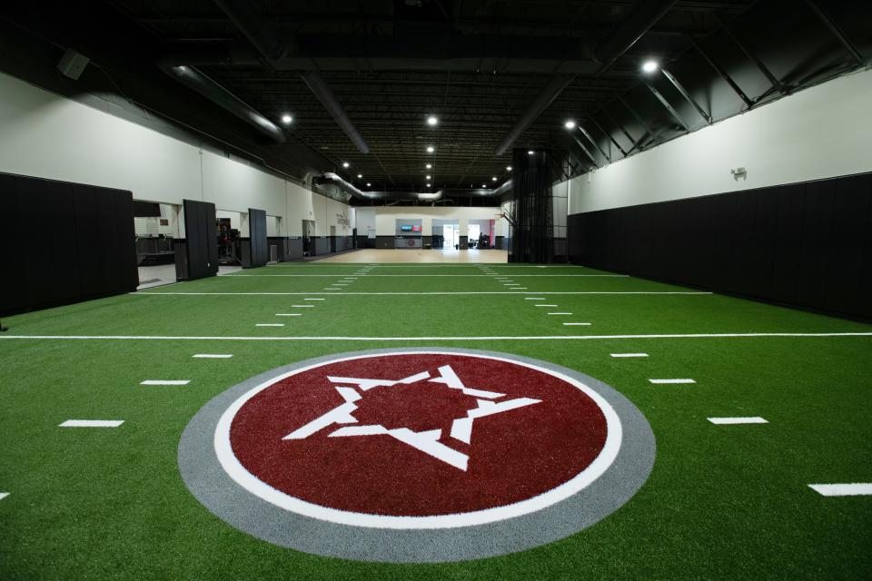 Part of the training space at Athletic Republic Knoxville is a small football field. A simulated basketball court is in the rear.