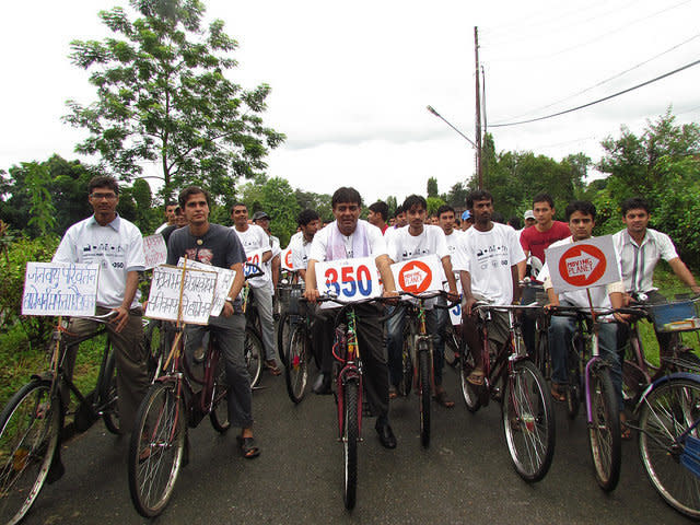 Constitutional Assembly member Shobhakar Parajuli rides with hundreds of other cyclists for a Moving Planet rally in Nepal  