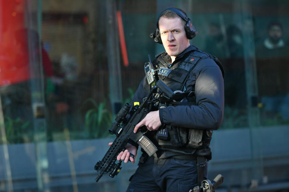 An armed police officer outside Borough Market after an incident on London Bridge in central London.