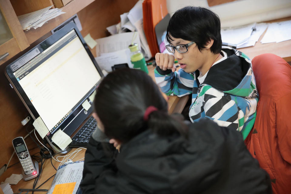 CHICAGO, IL - DECEMBER 15:  Justin Huang helps a client sign up for a health insurance program under the Affordable Care Act (ACA), also known as Obamacare, at the offices of the Midwest Asian Health Association in the Chinatown neighborhood on December 15, 2017 in Chicago, Illinois. Enrollment in the program ends today at midnight Pacific time in most states.  (Photo by Scott Olson/Getty Images)