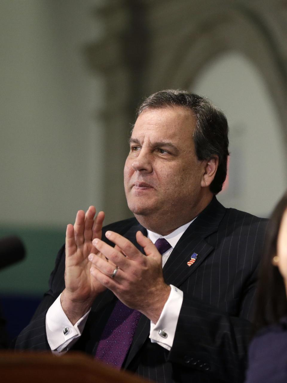 New Jersey Gov. Chris Christie applauds during a gathering in Union City, N.J., Tuesday, Jan. 7, 2014. A top aide to Christie is linked through emails and text messages to a seemingly deliberate plan to create traffic gridlock in a town at the base of a major bridge after its mayor refused to endorse Christie for re-election. "Time for some traffic problems in Fort Lee," Christie aide Bridget Anne Kelly wrote in an Aug. 13 email to David Wildstein, a top political appointee at the Port Authority of New York and New Jersey, which runs the George Washington Bridge connecting New Jersey and New York City, one of the world's busiest spans. (AP Photo/Mel Evans)