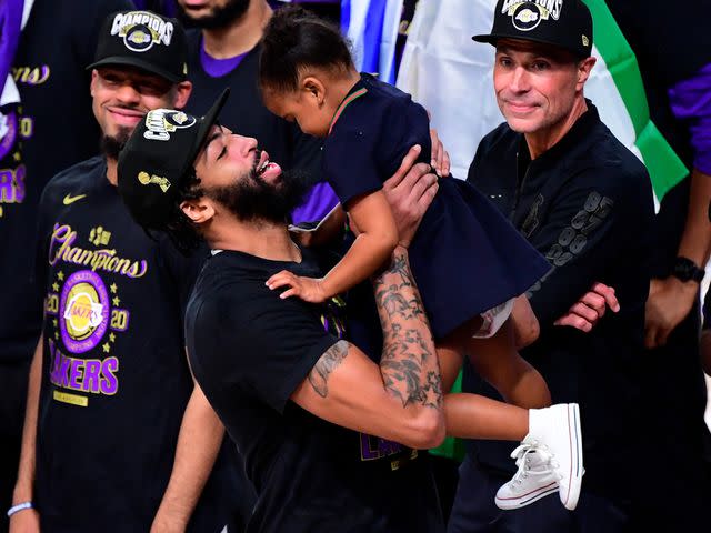 <p>Douglas P. DeFelice/Getty</p> Anthony Davis with his daughter Nala after winning the 2020 NBA Championship over the Miami Heat in Game Six of the 2020 NBA Finals on October 11, 2020 in Lake Buena Vista, Florida.