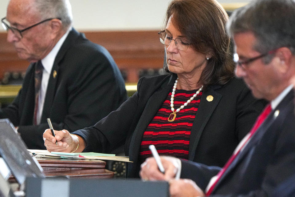 Sen, Angela Paxton keeps track of the votes Saturday in the impeachment trial of her husband, Attorney General Ken Paxton.