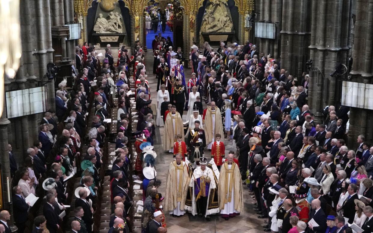 King Charles III, front center, and Queen Camilla, middle center, walk in the Coronation Procession - WPA Pool