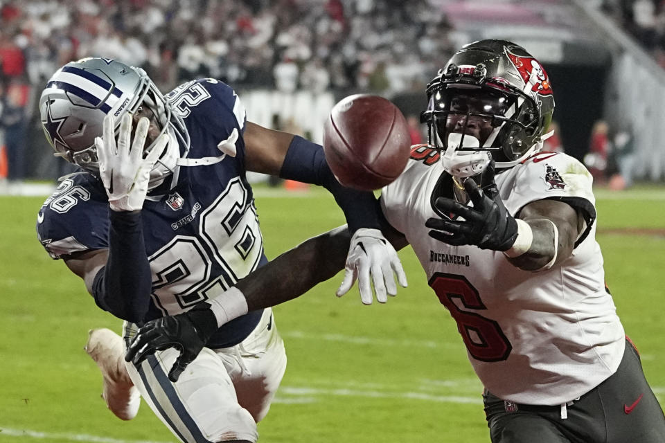 Dallas Cowboys cornerback DaRon Bland (26) deflects a pass intended for Tampa Bay Buccaneers wide receiver Julio Jones (6) during the second half of an NFL wild-card football game, Monday, Jan. 16, 2023, in Tampa, Fla. (AP Photo/Chris Carlson)