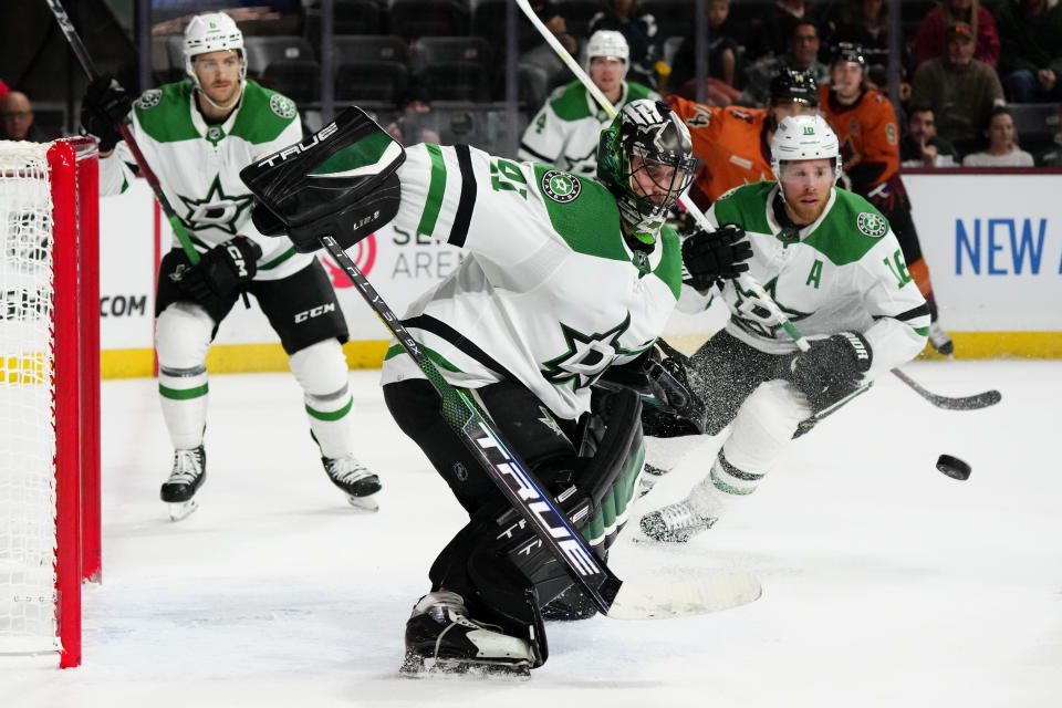 Dallas Stars goaltender Scott Wedgewood (41) makes a save of an Arizona Coyotes shot as Stars center Joe Pavelski (16) and defenseman Colin Miller, left, watch during the third period of an NHL hockey game in Tempe, Ariz., Thursday, Nov. 3, 2022. The Stars won 7-2. (AP Photo/Ross D. Franklin)