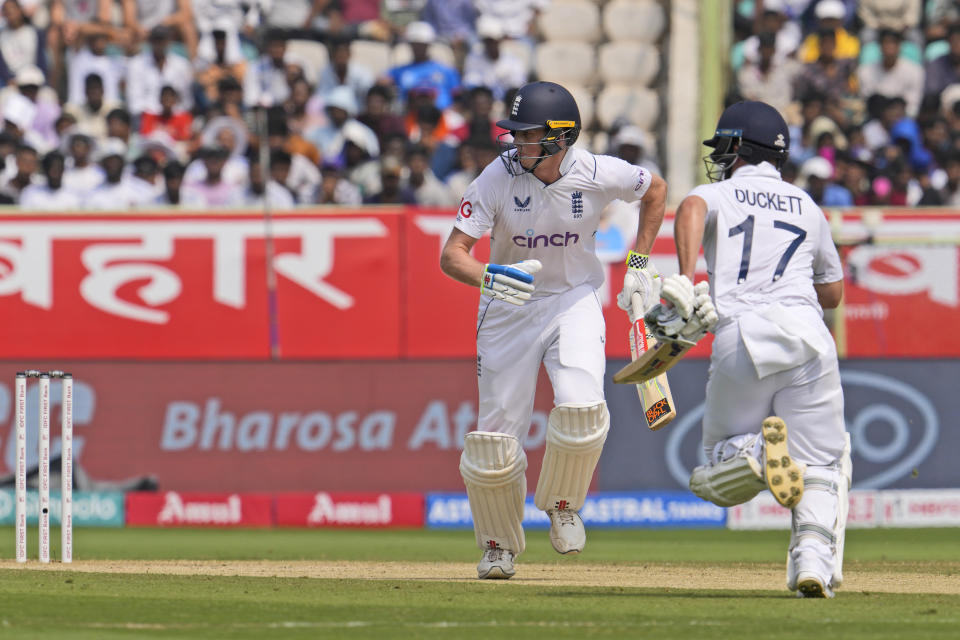 England's Zak Crawley and Ben Duckett run between the wickets on the second day of the second cricket test match between India and England in Visakhapatnam, India, Saturday, Feb. 3, 2024. (AP Photo/Manish Swarup)