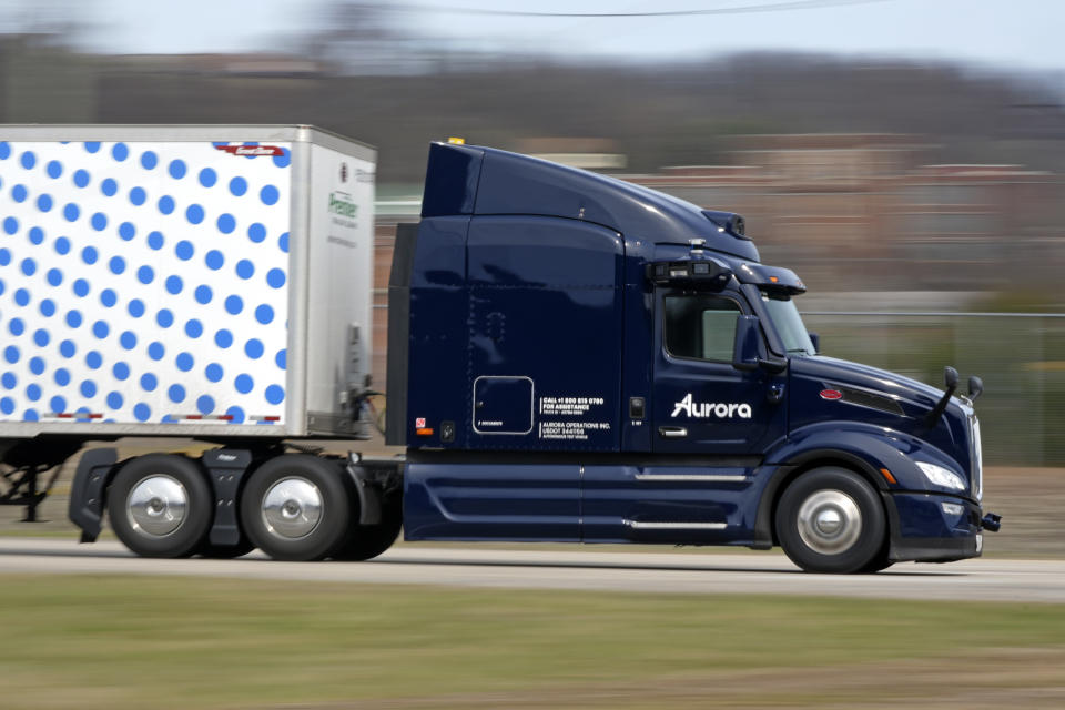 A self-driving tractor trailer maneuvers around a test track in Pittsburgh, Thursday, March 14, 2024. The truck is owned by Pittsburgh-based Aurora Innovation Inc. Late this year, Aurora plans to start hauling freight on Interstate 45 between the Dallas and Houston areas with 20 driverless trucks. (AP Photo/Gene J. Puskar)