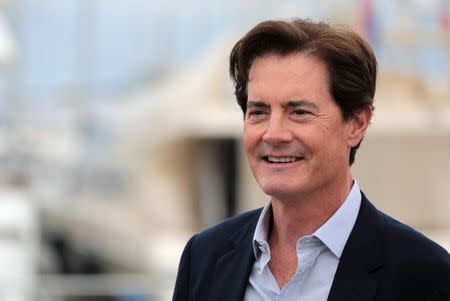 Actor Kyle MacLachlan poses during a photocall for the television series "Twin Peaks" during the annual MIPCOM television programme market in Cannes, France, October 17, 2016. REUTERS/Eric Gaillard