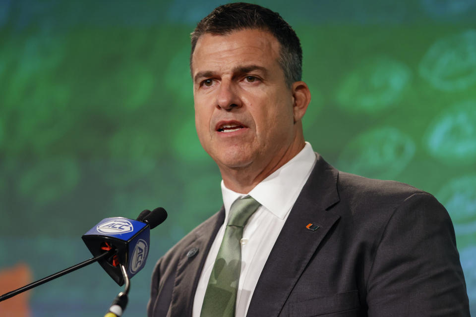 Miami head coach Mario Cristobal answers a question at the NCAA college football Atlantic Coast Conference Media Days in Charlotte, N.C., Thursday, July 21, 2022. (AP Photo/Nell Redmond)