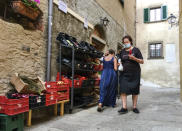 Residents of Giglio island shop in the steep alleys near the port, Tuesday, June 23, 2020. In spite of various people with coronavirus stopped by the island at times, no one of the islanders developed COVID-19 infection. For Paola Muti, a professor of Epidemiology, being trapped by lockdown in her late mother’s house for months on Giglio Island, the situation also made for an opportunity to possibly contribute to scientific understanding of why some people in close contact with people ill with COVID-19 don’t get infected. (AP Photo/Paolo Santalucia)