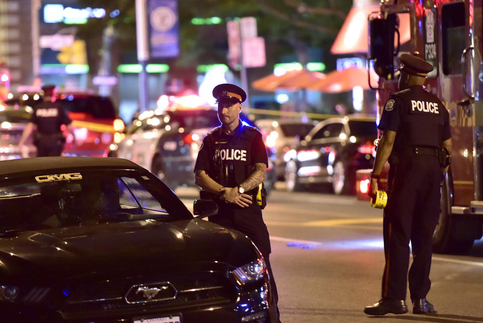 <p>Police work the scene of a shooting in Toronto on Sunday, July 22, 2018. (Photo: Frank Gunn/The Canadian Press via AP) </p>