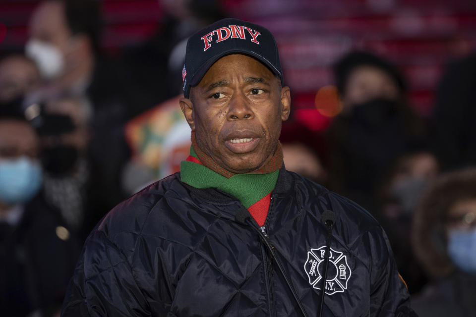 New York City Mayor Eric Adams speaks during a candlelight vigil in honor of Michelle Alyssa Go, a victim of a recent subway attack, at Times Square on Tuesday, Jan. 18, 2022, in New York. (AP Photo/Yuki Iwamura)