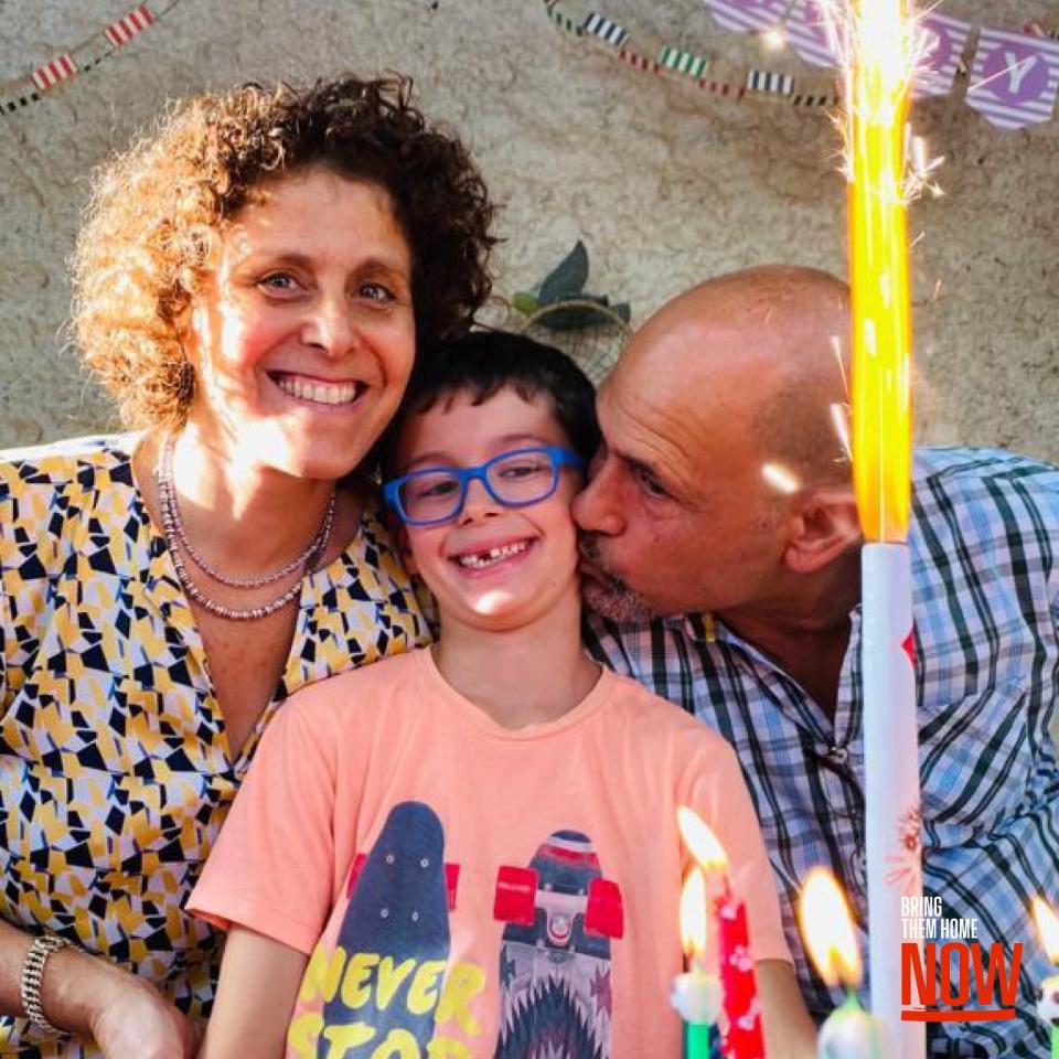 Ohad pictured on his eighth birthday, with his parents. (family handout)