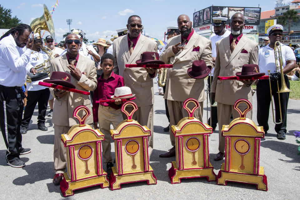 Members of the New Wave Brass Band with We Are One and Keep n it Real Social Aid & Pleasure Clubs perform a Jazz Funeral for George Wein at the New Orleans Jazz and Heritage Festival, on Friday, April 29, 2022, in New Orleans. (Photo by Amy Harris/Invision/AP)