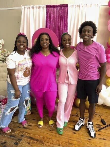 This undated photo provided by the family of Phil Dowdell shows from left, Zaniriah Dowdell, Latonya Allen, Alexis Dowdell and Phil Dowdell. Phil Dowdell was one of four young people killed when a shooting broke out at a Sweet 16 birthday party in Dadeville, Ala., on April 15, 2023. Dowdell was headed to Jacksonville State University in the fall where he planned to play football. (Family of Phil Dowdell via AP)