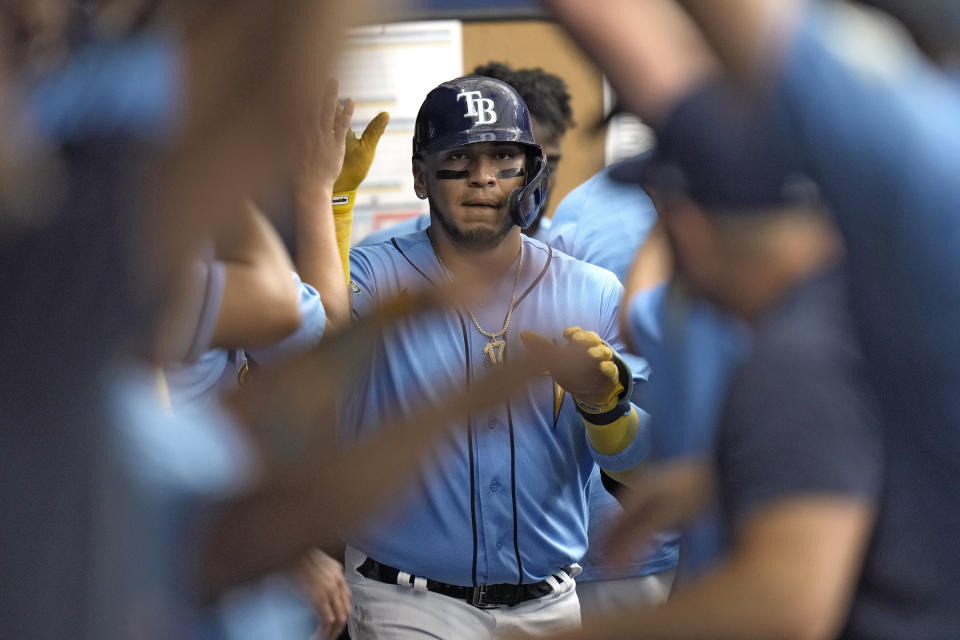 Tampa Bay Rays' Isaac Paredes celebrates in the dugout after his home run off Baltimore Orioles starting pitcher Tyler Wells during the second inning of a baseball game Wednesday, June 21, 2023, in St. Petersburg, Fla. (AP Photo/Chris O'Meara)