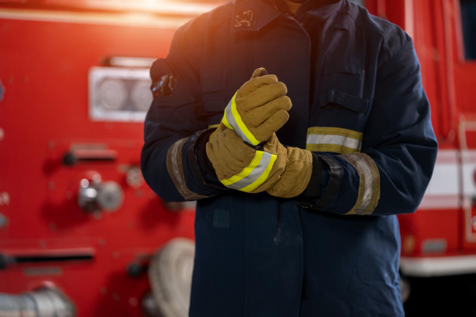 Fireman with gas mask and helmet at fire station,Firefighters intervening in a pernicious disaster or fire.