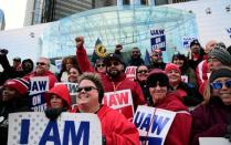 Striking United Auto Workers (UAW) members rally in front of General Motors World headquarters in Detroit