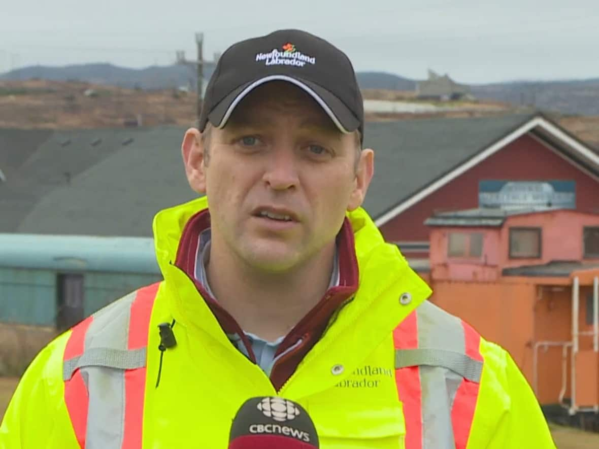 Newfoundland and Labrador Premier Andrew Furey landed in Channel-Port aux Basques early Thursday afternoon, flying into the community via helicopter due to roads being washed out by the storm that has blanketed the southwestern part of the province.  (Garrett Barry/CBC - image credit)