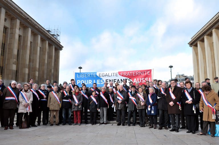 Some 50 mayors and deputy mayors demonstrate against a draft law to authorise gay marriage and adoption on December 15, 2012 in Paris. Passions and tensions are rising in France ahead of an expected giant weekend rally against the government's plan to legalise same-sex marriage and adoption that has angered influential Catholic and Muslim groups