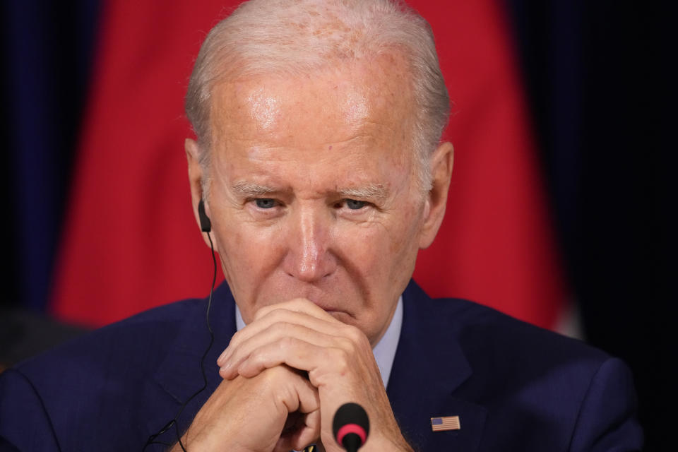 U.S. President Joe Biden listens during a meeting with South Korean President Yoon Suk Yeol and Japanese Prime Minister Fumio Kishida during the Association of Southeast Asian Nations (ASEAN) summit, Sunday, Nov. 13, 2022, in Phnom Penh, Cambodia. (AP Photo/Alex Brandon)