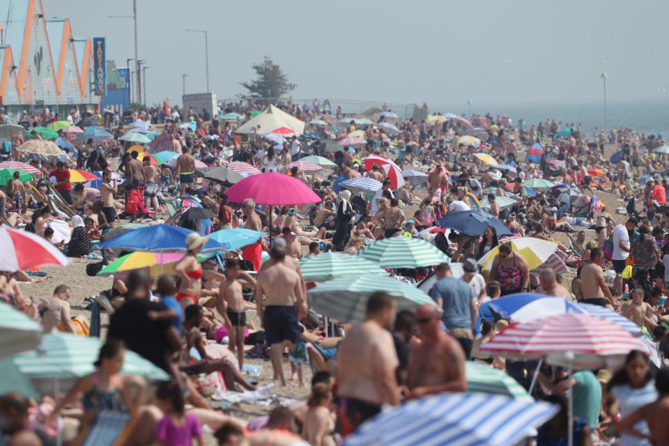 Crowds on Southend beach in Essex (PA)