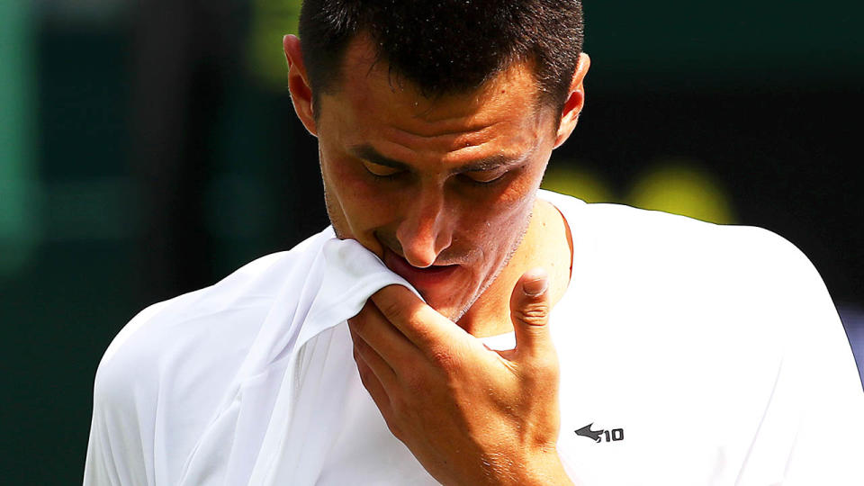 Bernard Tomic was stripped of his full prize purse after his first round loss. (Photo by Clive Brunskill/Getty Images)