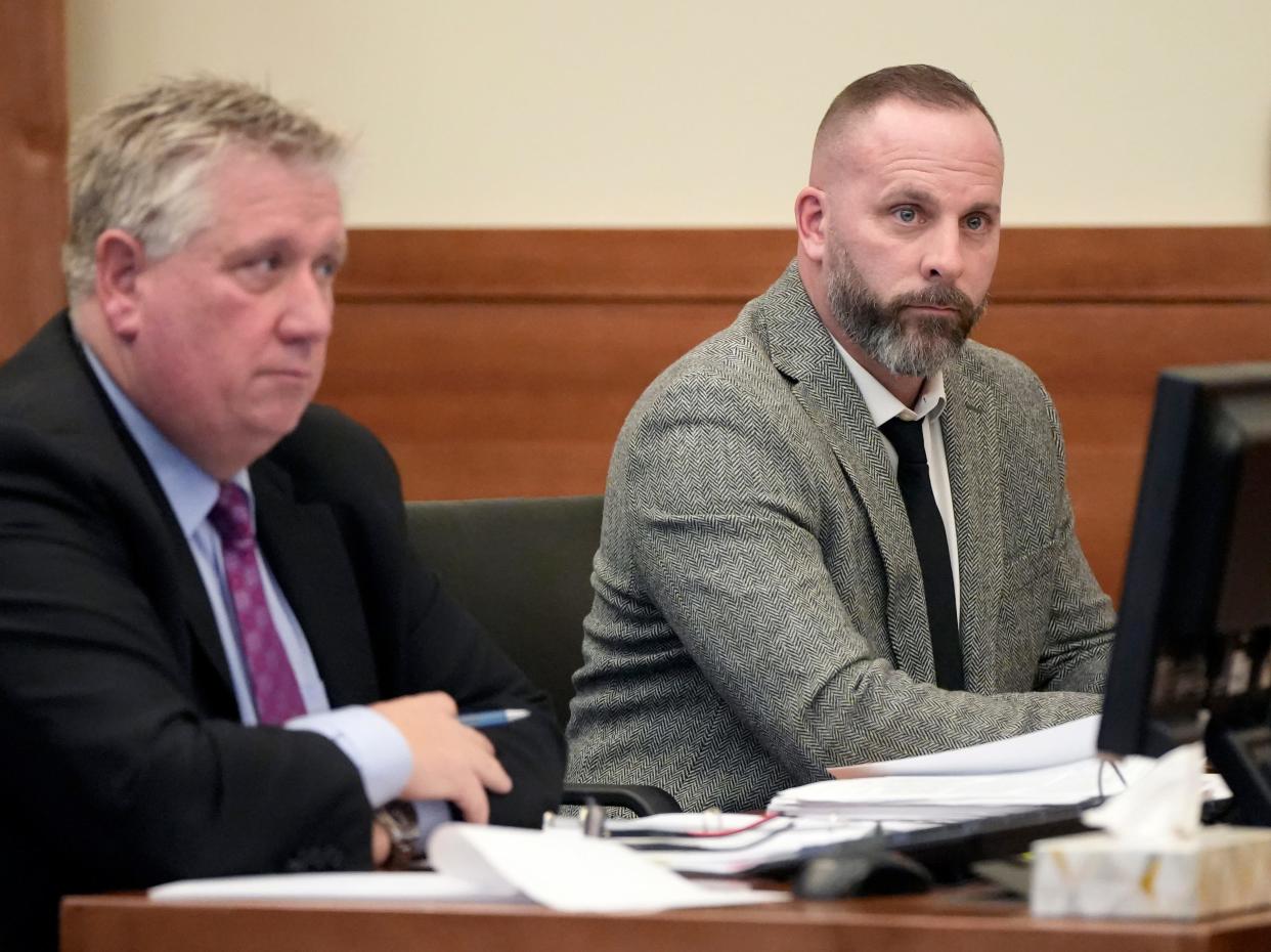 Former Franklin County Sheriff's SWAT deputy Jason Meade, right, with one of his defense attorneys, Mark Collins, on Feb. 23, 2023 in Franklin County Common Pleas Court.