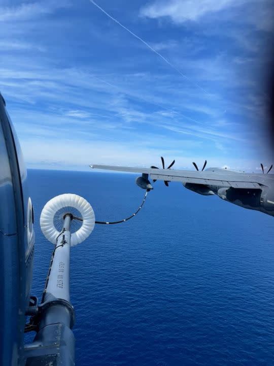 An HH-60G Pave Hawk helicopter receives fuel from an HC-130J Combat King II during a civilian medical airlift operation of a critical patient aboard a cruise ship more than 350 miles off the eastern coast of U.S. May 4, 2024. The mission, carried out by two HH-60s, two HC-130Js, and two teams of combat rescue officers and pararescuemen required three air-to-air refuelings. The more than 8-hour mission covered more than 1,200 miles round trip over open ocean. (Courtesy photo)