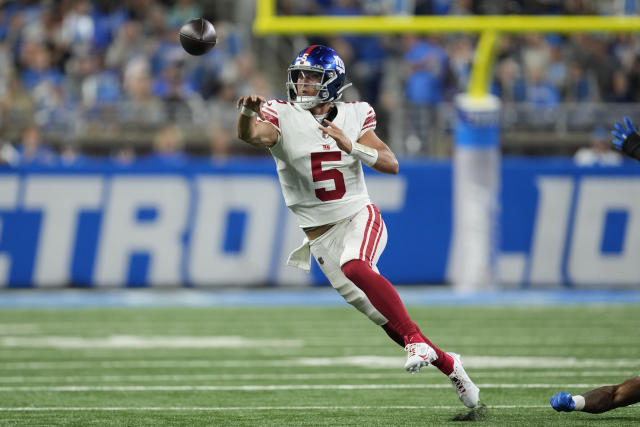 Detroit Lions quarterback Adrian Martinez (18) keeps the ball