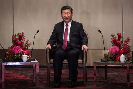 China's President Xi Jinping speaks with outgoing Hong Kong Chief Executive Leung Chun-ying (not pictured) during a meeting in a hotel in Hong Kong, China, June 29, 2017. REUTERS/Dale de la Rey/Pool