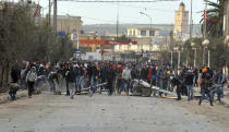 <p>Protesters take the streets during anti-government protests, in Tebourba, south of the Tunisian capital, Tunis, Tuesday, Jan. 9, 2018. (Photo: Anis Ben Ali/AP) </p>